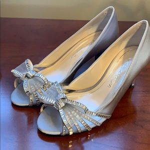 Silver formal heels with bow.